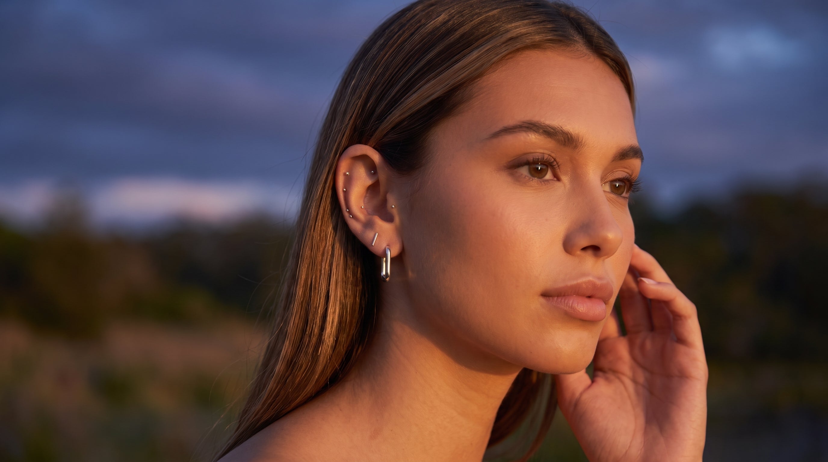 Model sunbathing with ear seeds